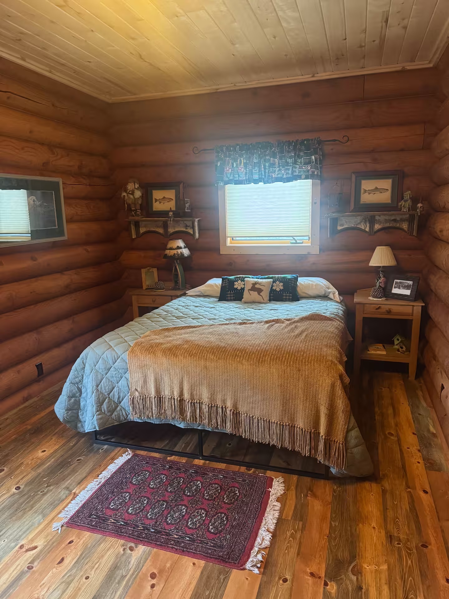 Warm wood-lined cabin bedroom