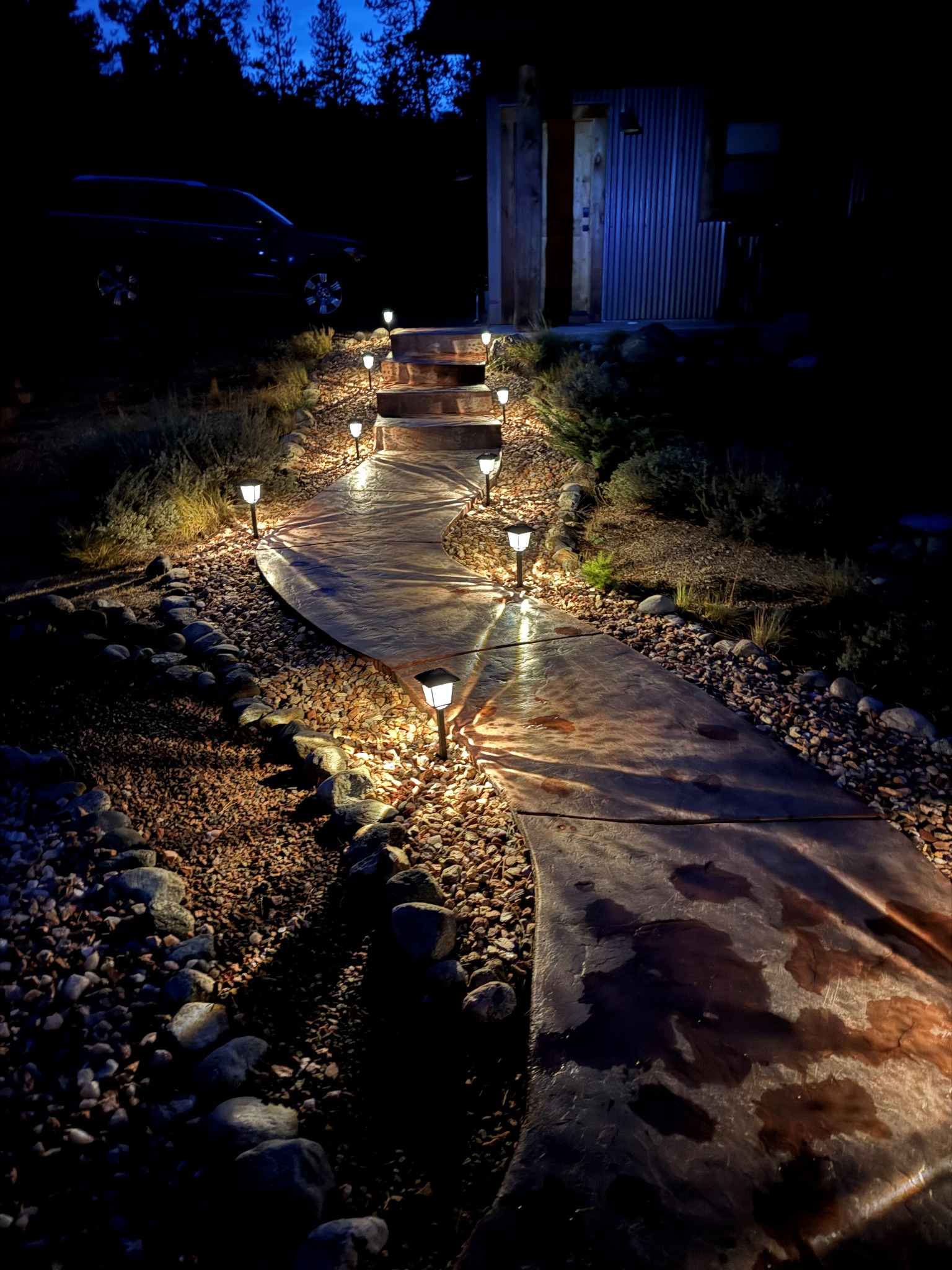 Illuminated walkway at night